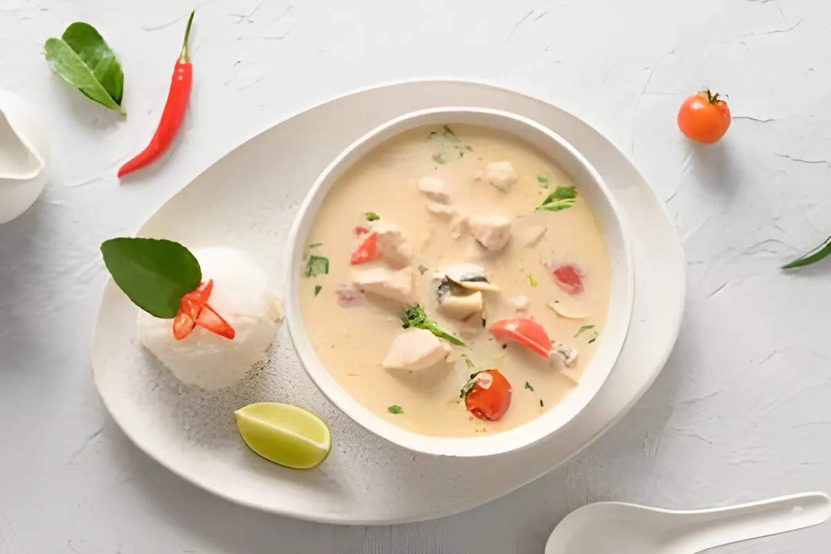 A pot of hearty chicken soup with fresh herbs