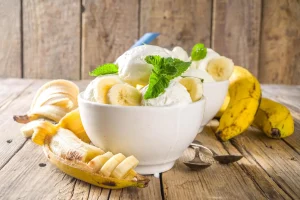 No-bake banana pudding with whipped cream topping in a serving dish - Easy Banana Pudding Variant