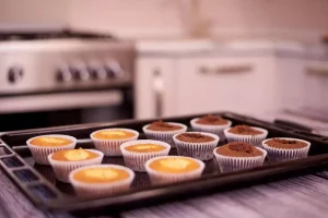 Freshly baked muffins cooling on a wire rack