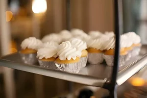 Ingredients for baking mini cupcakes on a kitchen counter