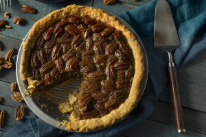 Fresh pecans being mixed into pie filling