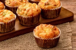 Muffin tray filled with batter ready for baking