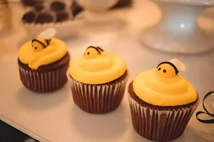 Assorted small cupcakes with colorful decorations